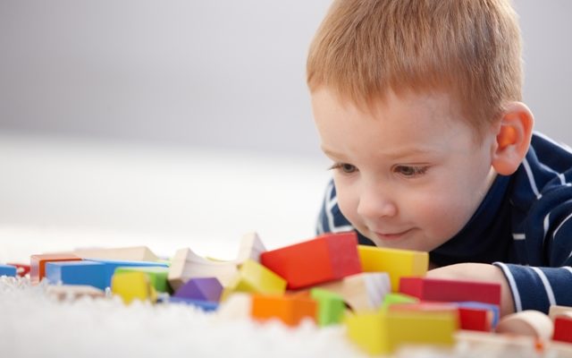 Child looking at blocks