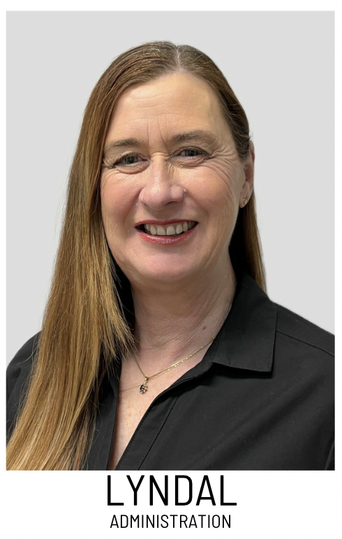 Portrait of Lyndal from Administration, smiling in a black blouse.