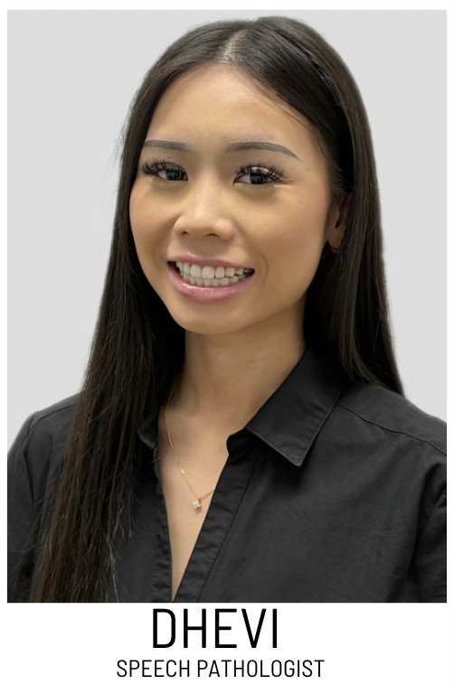 Portrait of Dhevi, a Speech Pathologist, smiling in a black collared shirt, head and shoulders.