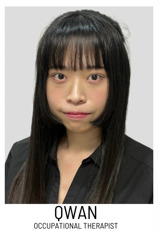Portrait of an occupational therapist with long black hair, wearing a black shirt, looking at the camera.